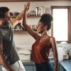 a couple dancing in the kitchen